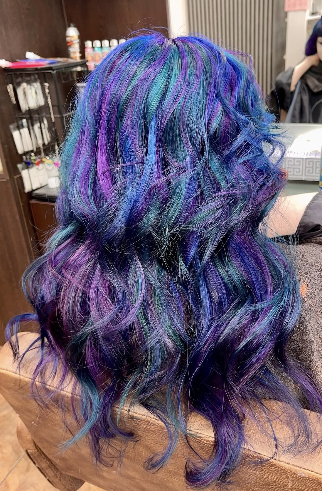 Long curled hair with blue, teal and violet colour